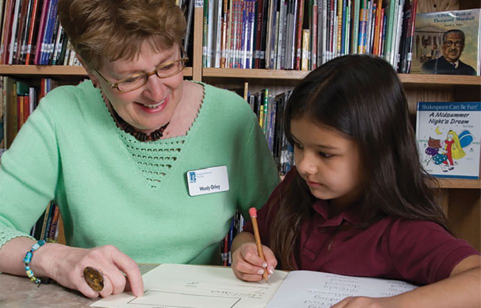 Tutors in GPLC’s OASIS Intergenerational Tutoring program help students in grades K-4 develop reading skills and self-esteem.