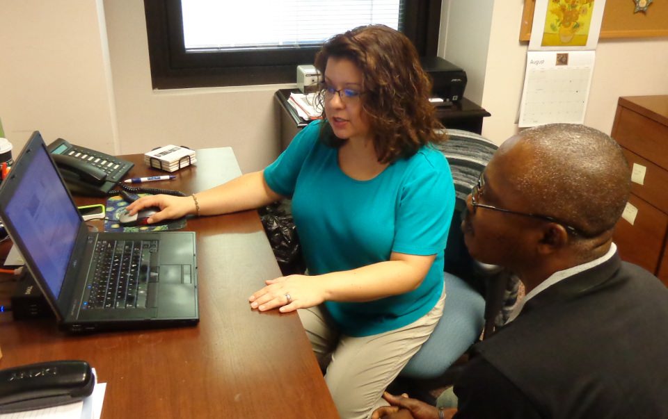 Transitions Manager Andrea Horton-Mericli meets with a student about his career goals and what skills and training are needed to reach them.