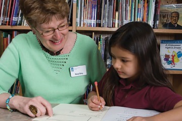 Tutors in GPLC’s OASIS Intergenerational Tutoring program help students in grades K-4 develop reading skills and self-esteem.